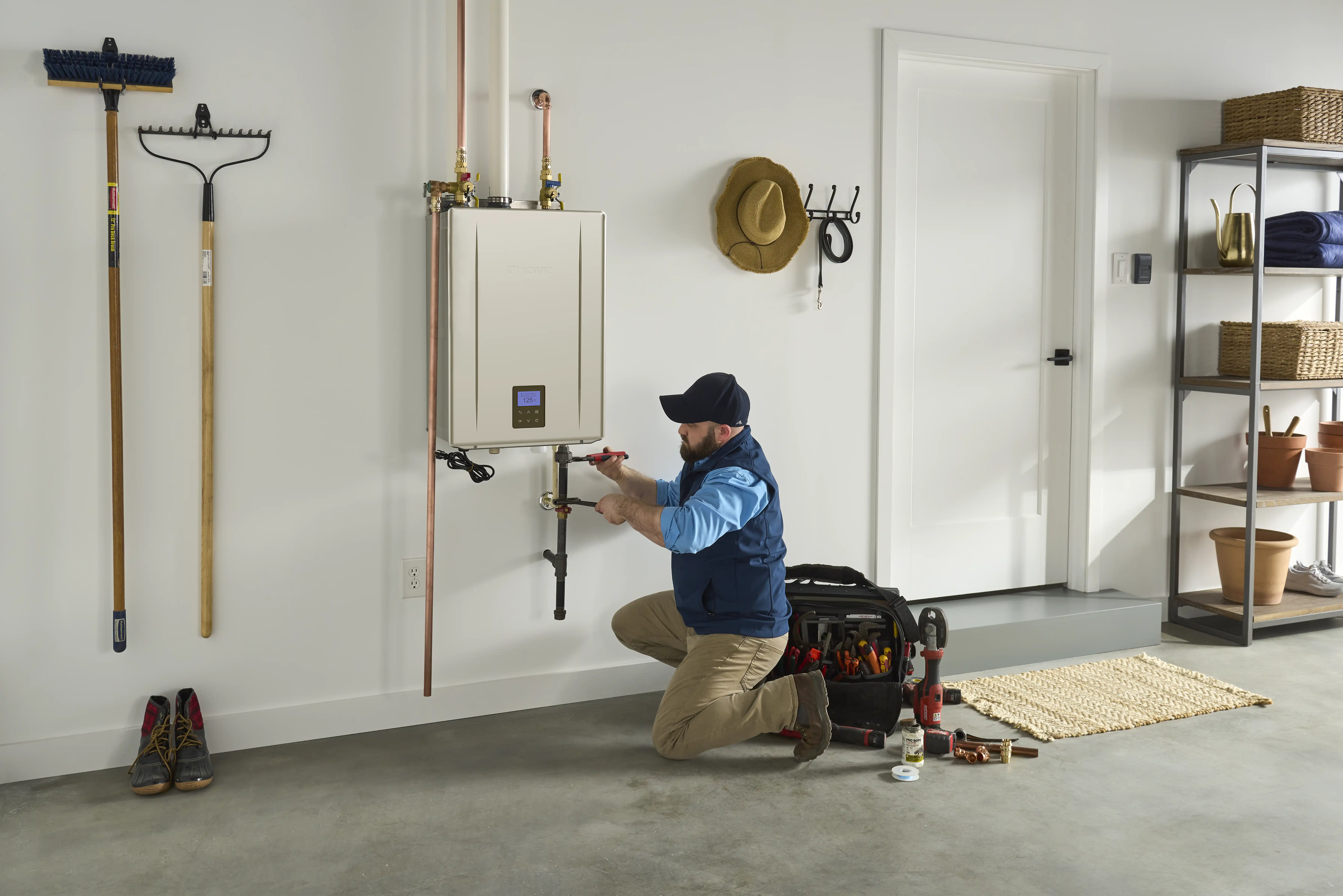 Installer working on Noritz tankless water heater