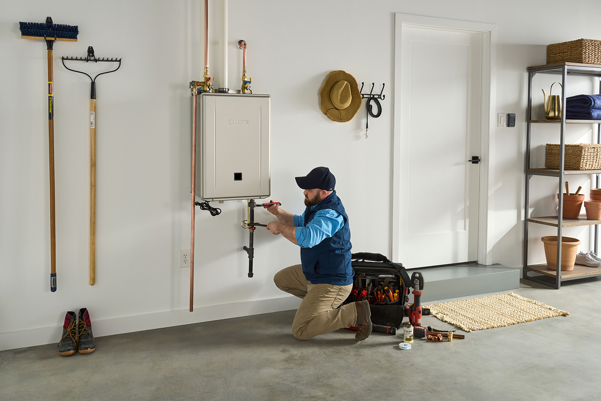Installer working on Noritz tankless water heater